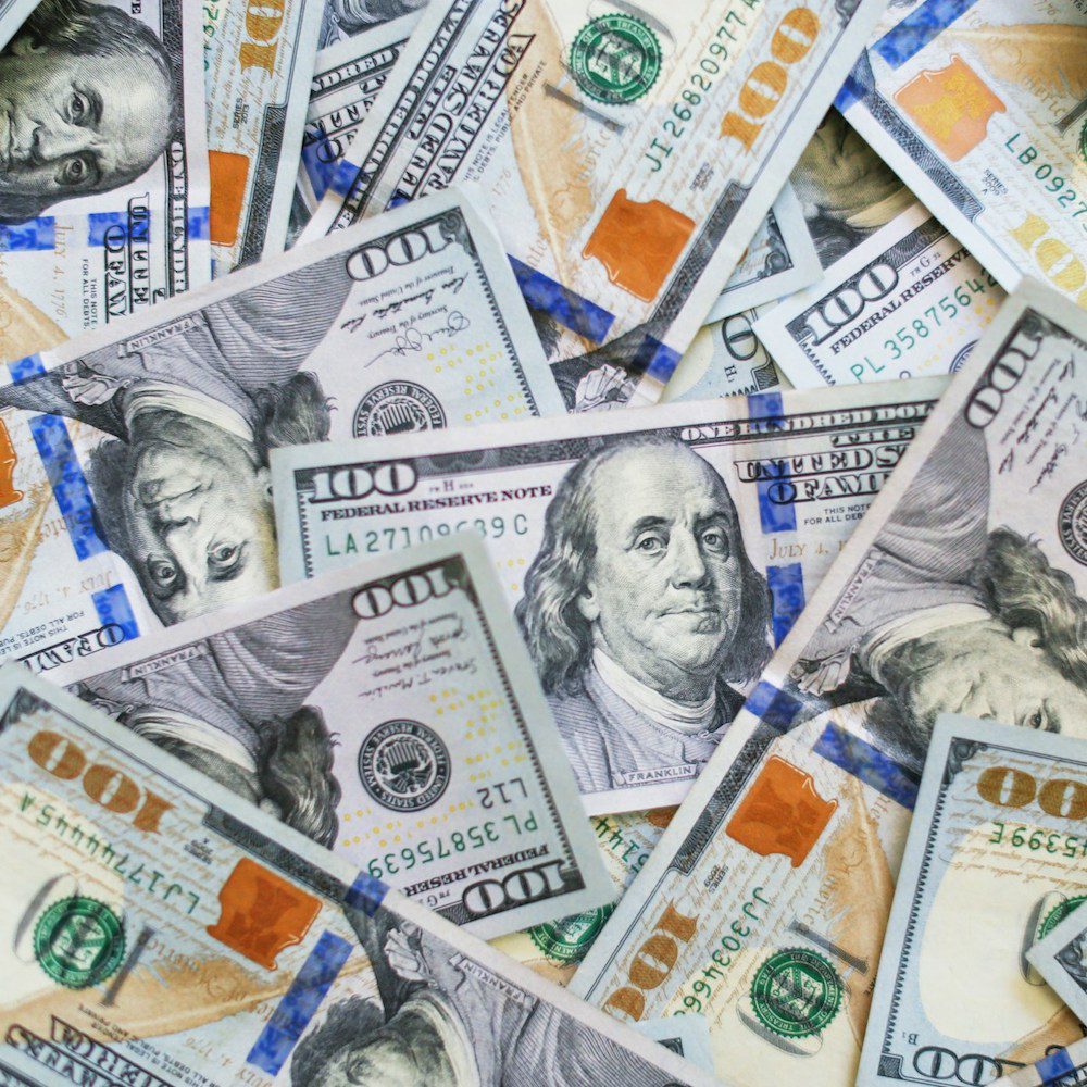 page-pedestrian-compensation Collage of $100 bills to reflect compensation from personal injury claim